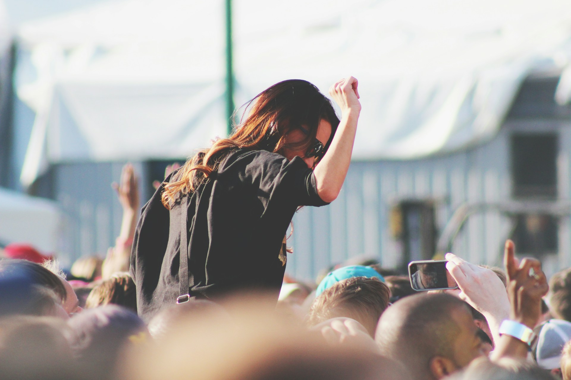 Woman on top of crowd